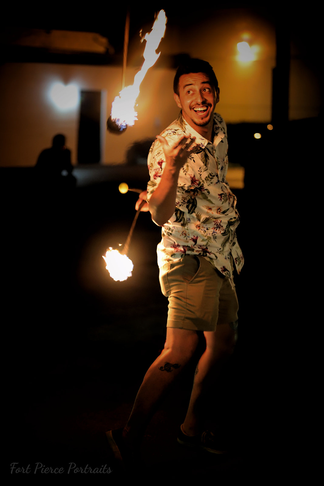 Close-up of a Spread The Flow performer spinning fire